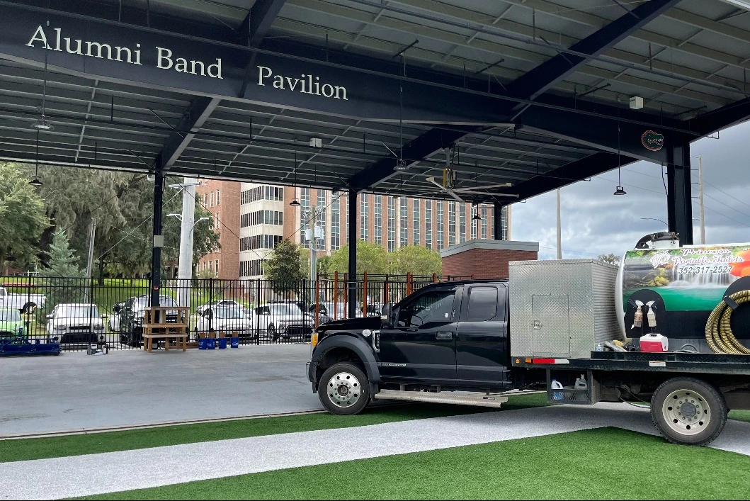 Princess Portable Toilet company truck parked at Alumni Band Pavilion