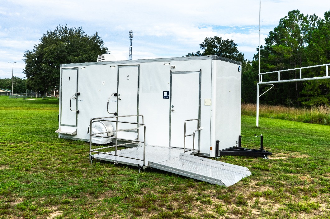 Portable Restroom Trailer in an open field