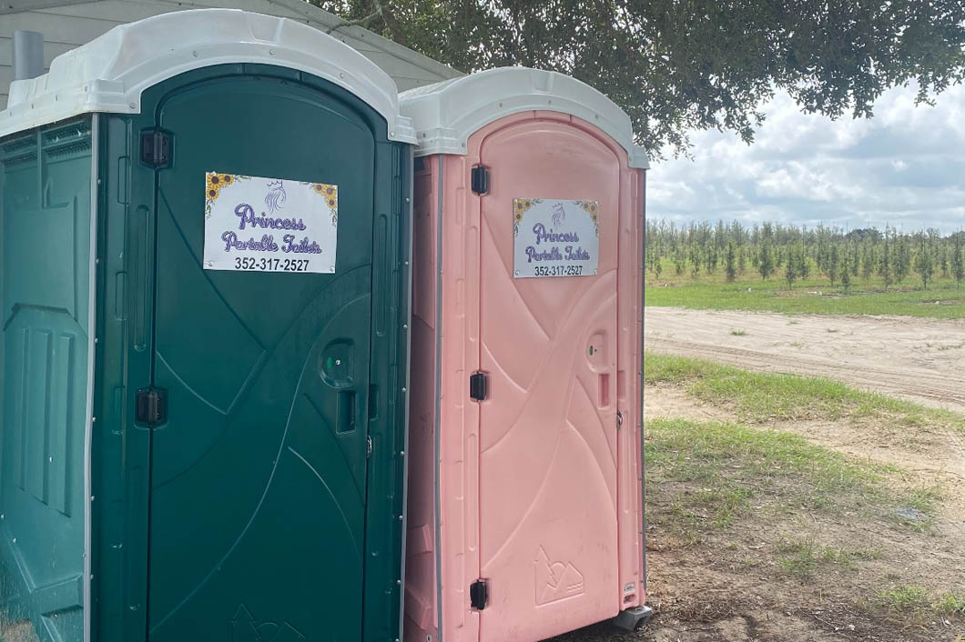 Princess Portable Toilets in an open field