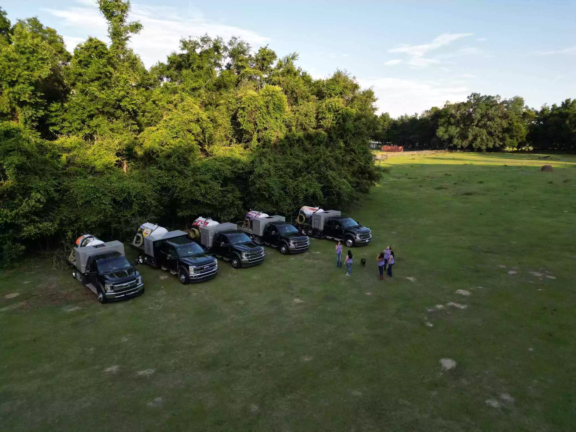 Princess Portable Toilets truck in an open field