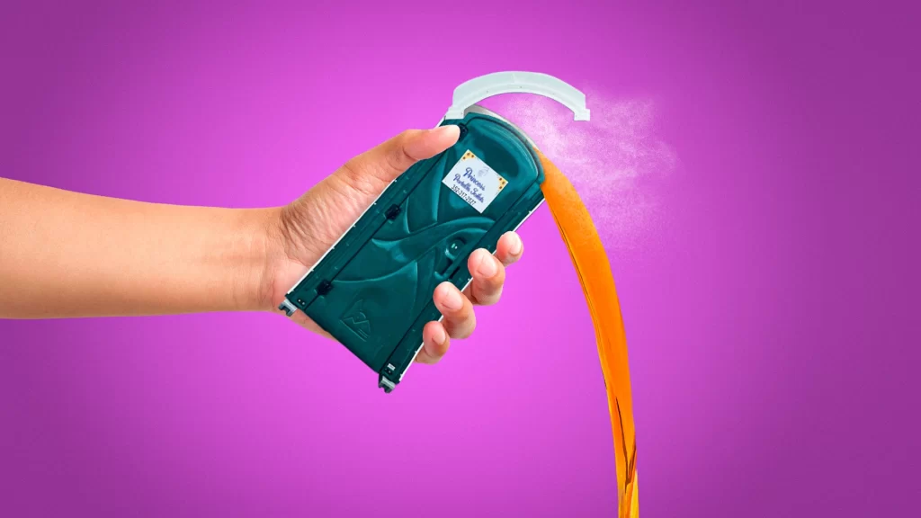 Giant hand holding a princess portable toilet as it empties waste in a dramatic scene