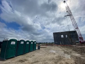 Princess flyable portable toilets placed on a construction site, ensuring sanitation for high-rise projects