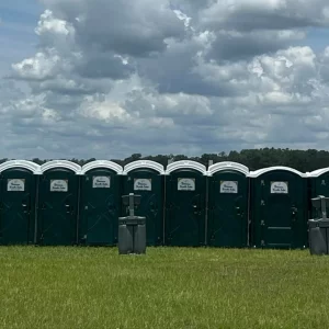 Several Princess Portable Toilets outdoors under clear skies, emphasizing eco-friendly sanitation practices and water-saving design
