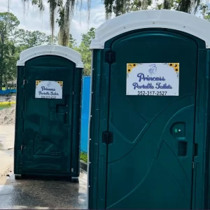 Two Princess Portable Toilets side by side, one with handicap-accessible features for inclusive and comfortable sanitation access