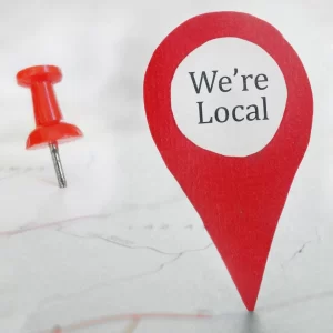 A pin and location icon labeled “We’re Local,” symbolizing Princess Portable Toilets’ strong community roots and regional service
