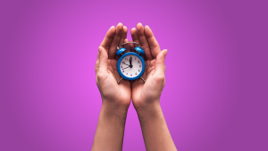 Hand holding a clock symbolizing timely delivery of professional portable toilet service in North Central Florida