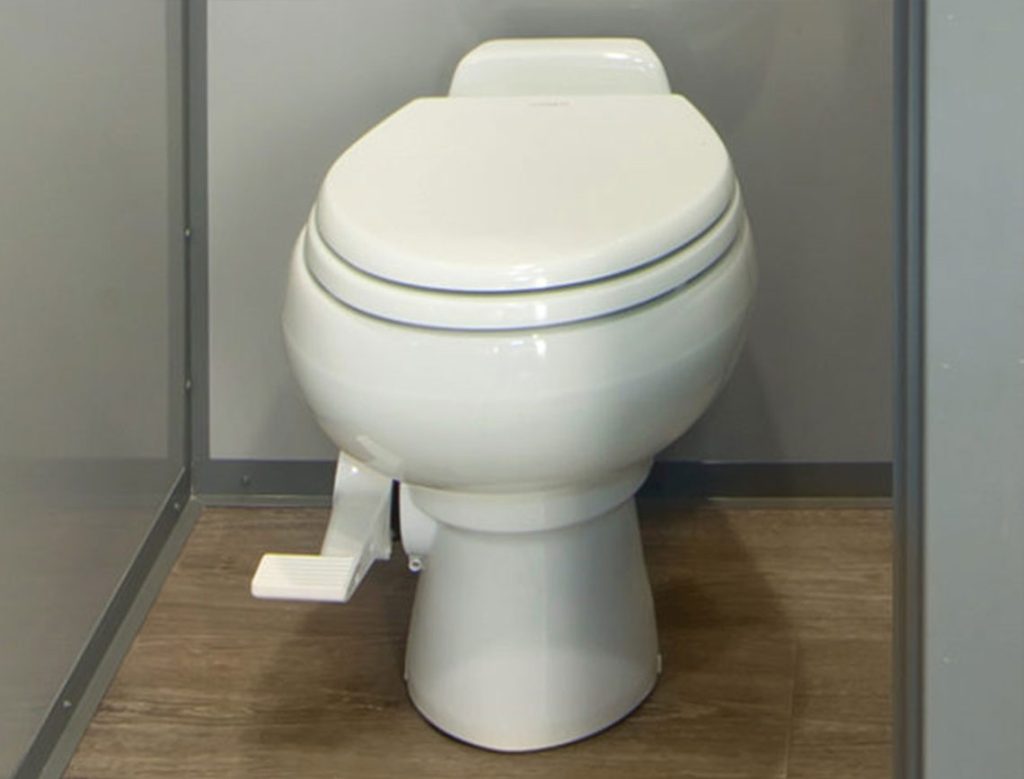 Flushable toilet inside a Princess Luxury Restroom Trailer
