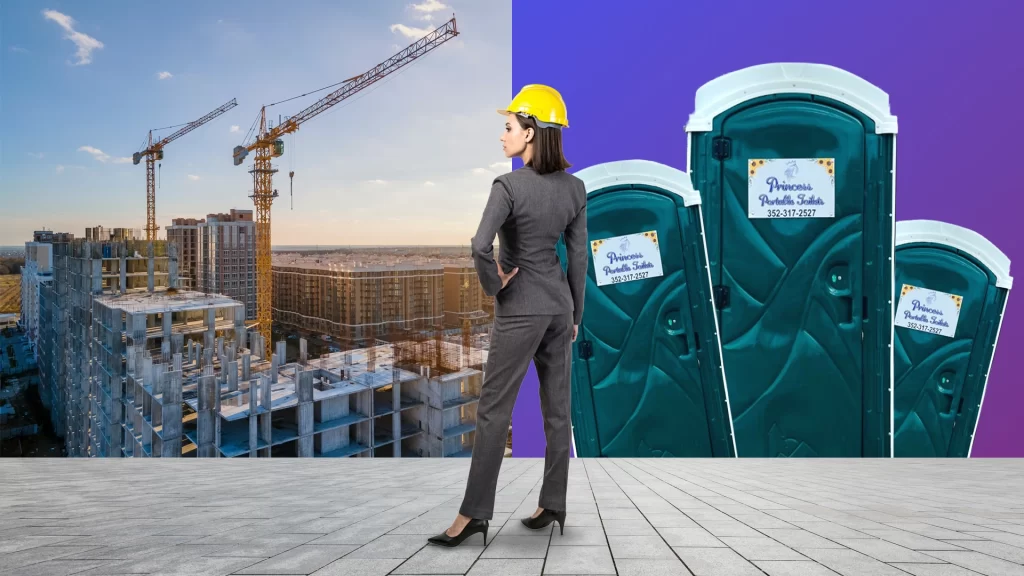 Woman in hard hat looking at Commercial Construction Porta Potty